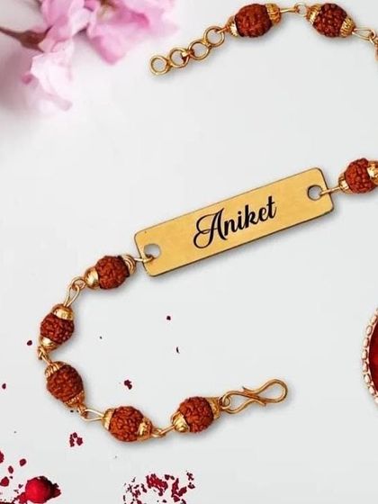 Another look at our popular custom name Rudraksha rakhi. The adjustable chain and high-quality engraving make this a comfortable and lasting gift for your brother.