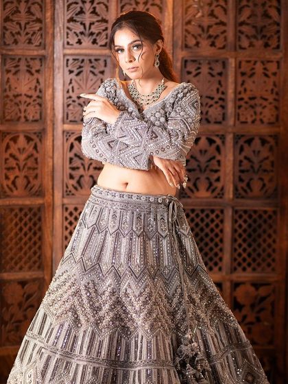 A complete look at my silver-grey geometric lehenga from a professional shoot. You can see the intricate details, the stylish back, and how it moves. It's a true work of art.