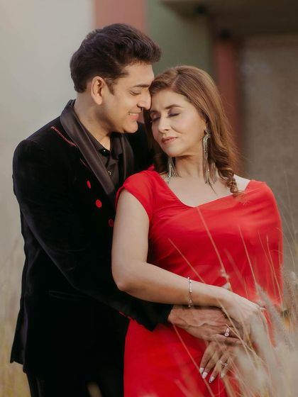 A close, loving embrace. Her makeup is flawless and timeless, perfect for celebrating a milestone anniversary.