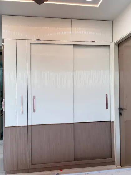 The full view of the completed two-tone wardrobe with both sliding and hinged sections.