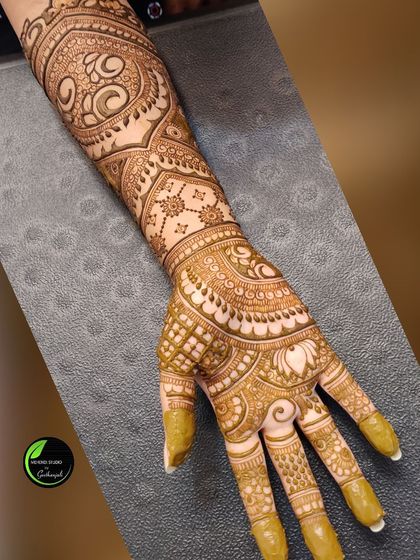 A single arm shot showing the excellent stain quality on a complex, full-arm design.