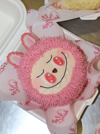 Another reveal from our Labubu Mystery Lunchbox Cake series. This one is a cheerful pink character, ready to be unboxed and enjoyed.