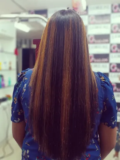 A classic example of babylights, where fine, subtle highlights are woven throughout the hair for a natural, all-over shimmer.