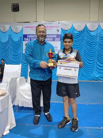 Sharvil receiving his Gold medal trophy for the U11 category at the Hospet Karnataka state ranking tournament.