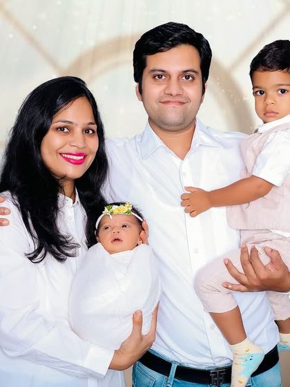 A beautiful first portrait as a family of four. We captured this moment in our studio, welcoming their newborn daughter alongside her proud big brother.