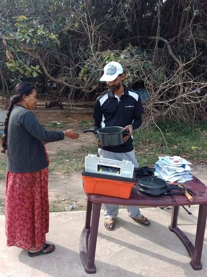 Our mentor Hamsa, who started her own community repair initiative, helps a neighbor. Her story is a testament to the ripple effect of our workshops.