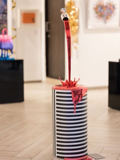 The full "Gravity Uncorked" sculpture, its playful illusion a centerpiece in the gallery.