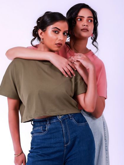 A beautiful portrait of two people connecting. The simple styling and clean background keep the focus on their interaction and shared moment.