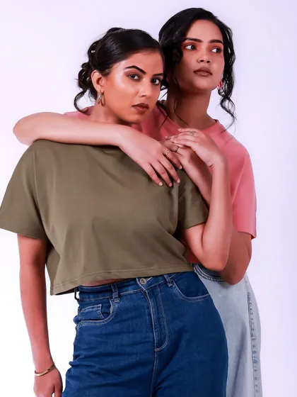 A beautiful portrait of two people connecting. The simple styling and clean background keep the focus on their interaction and shared moment.