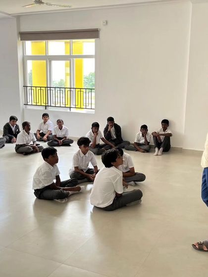 An instructor at SVIS addresses a class of students, setting the stage for a hands-on learning session.