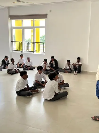 An instructor at SVIS addresses a class of students, setting the stage for a hands-on learning session.