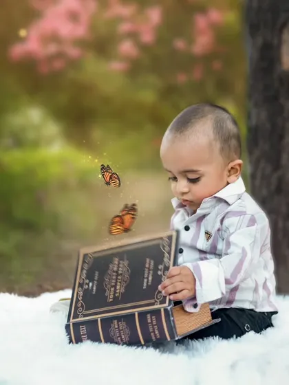 A magical moment in the woods, where a little boy discovers butterflies coming out of a book. We love adding a touch of fantasy to our outdoor shoots.