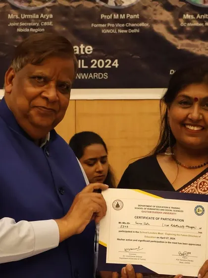 Another one of our mentors receiving a certificate at an education summit. We are proud of our team's recognition and their role as leaders in educational reform.