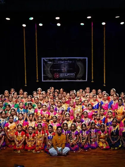 This is my family. Seeing all my students together for Nrithya Sandhya fills my heart with oru santhosham, a unique happiness. From the youngest beginners to the senior performers, this is the result of our shared passion.