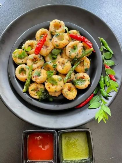 We love adding unique items to our menu, like these savoury mini rice flour rings. Lightly spiced and pan-fried, they are served with classic red and green chutneys, making for a delicious and bite-sized snack.