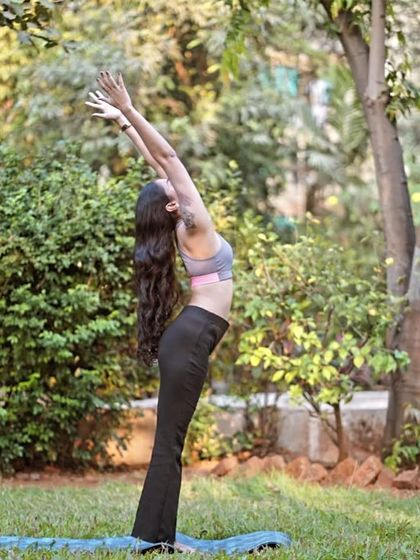 A standing backbend (Anuvittasana) practiced outdoors. This pose is a wonderful heart-opener and a great way to energize the body while connecting with nature.