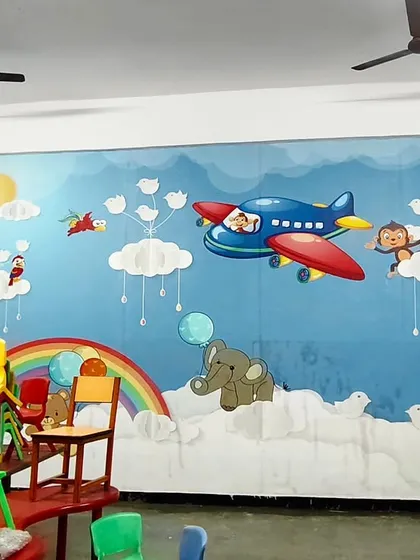I enjoy brightening up spaces for children, like this cheerful mural in a school. The colorful design with airplanes, clouds, and animals creates a fun and imaginative atmosphere perfect for a learning environment.