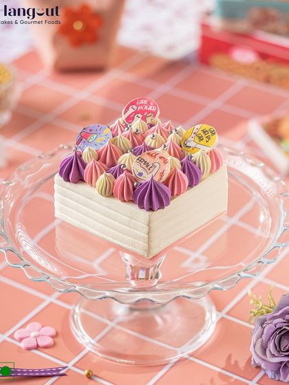 Celebrate Women’s Day with our best-selling pineapple cake. It's beautifully adorned with pink and purple frosting and topped with white chocolate elements to honor incredible women.