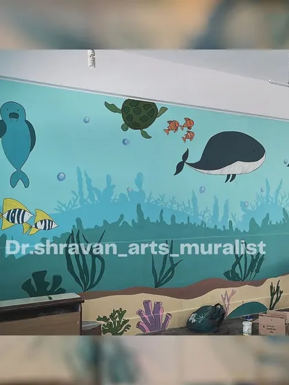 Another underwater-themed wall painting for a school, with whales, turtles, and colorful fish swimming in a serene blue sea. It’s a great way to make learning environments more engaging.
