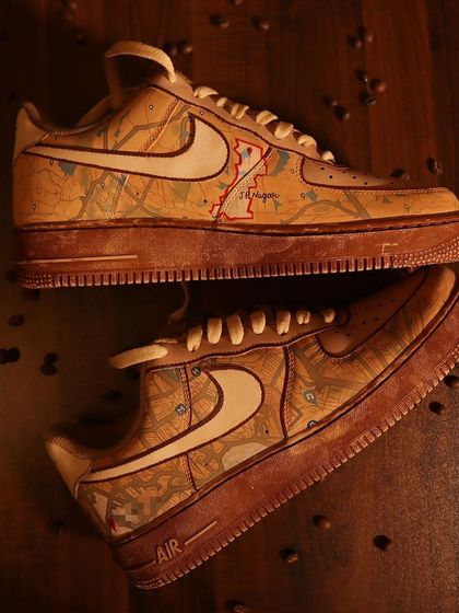 A different angle of the custom Google Maps-themed sneakers. The coffee-dye process gives the shoe a warm, sepia tone that perfectly complements the detailed map artwork.