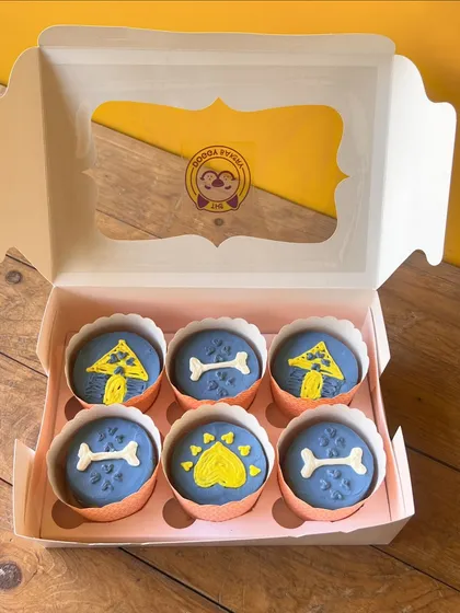 For a smaller, yet equally special treat, I offer gourmet dog cupcakes. This box of six features custom designs like bones, paws, and dog houses, all made with the same human-grade ingredients and care as my larger cakes. They are perfect for sharing or a personal indulgence.