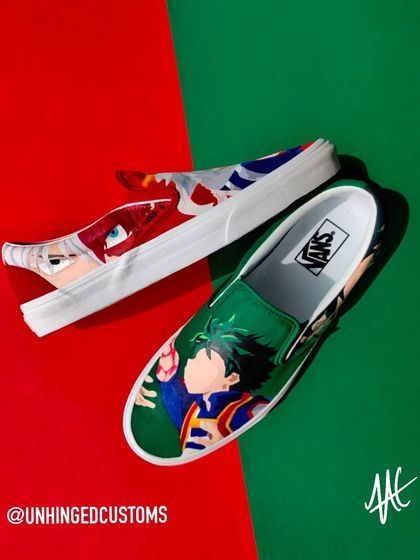 A creative shot of the Midoriya and Todoroki custom Vans, playing with the red and green background to match the characters.