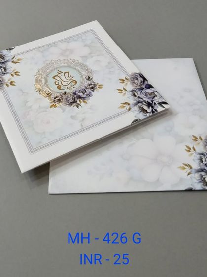 A beautiful and affordable invitation with a floral background and a central Ganesha emblem. The purple and gold color combination is both royal and serene.