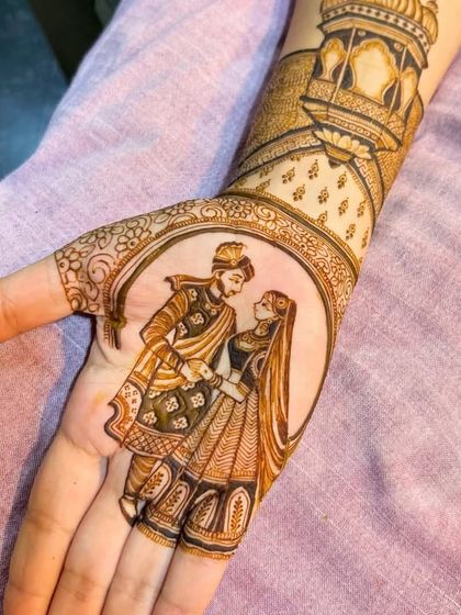 The same beautiful couple portrait, showing the fine details in the clothing and expressions that bring the henna art to life.