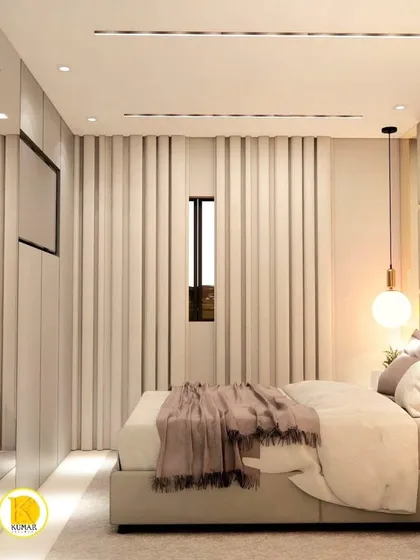 A modern bedroom with a minimalist design. The mirrored wardrobe and fluted wall panels add texture and a sense of space.