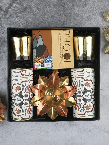 The 'Divine' Diwali hamper is a thoughtful and festive choice. It includes two patterned jars, a large lotus diya, and organic incense from Phool.