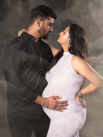 An intimate gaze between partners, captured with an artistic smoky effect for a dreamy and romantic feel.