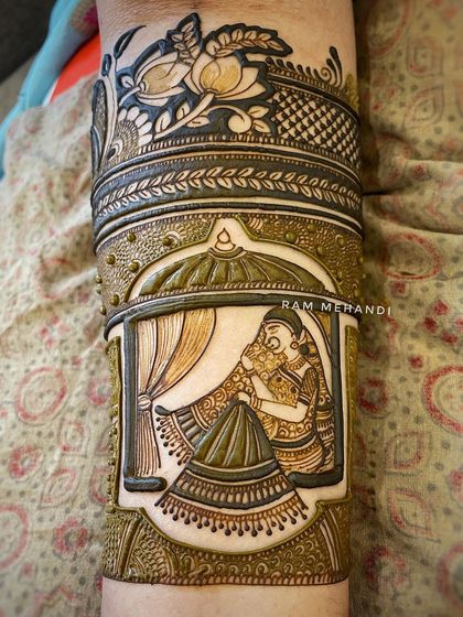 This close up shows the fine shading and detail work in a jharokha bride scene. The design is framed with beautiful lotus patterns, adding to the elegance.