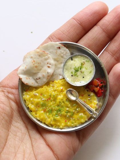 A tiny plate of khichdi and kadhi, a simple yet soulful meal recreated in clay.