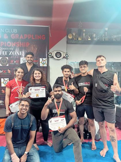 The winning team. Our students and coaches celebrate their success at the open kickboxing championship.