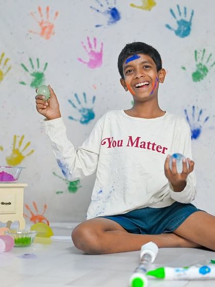Holi is a festival of joy, and these photoshoots capture that perfectly. We use a colourful handprint backdrop and safe, vibrant powders for a fun and memorable session. It's even more fun when a furry friend joins in!