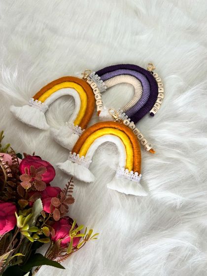 A beautiful flat lay of my personalized rainbow keychains. The yellow and purple color schemes are so vibrant.