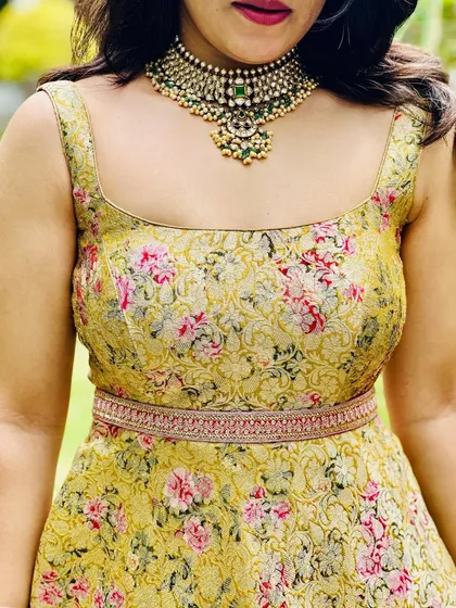 Amulya looks ethereal in this hand-stitched gown made from a floral brocade fabric. I added a custom hand-embroidered waist belt to define the silhouette and add a touch of sparkle.