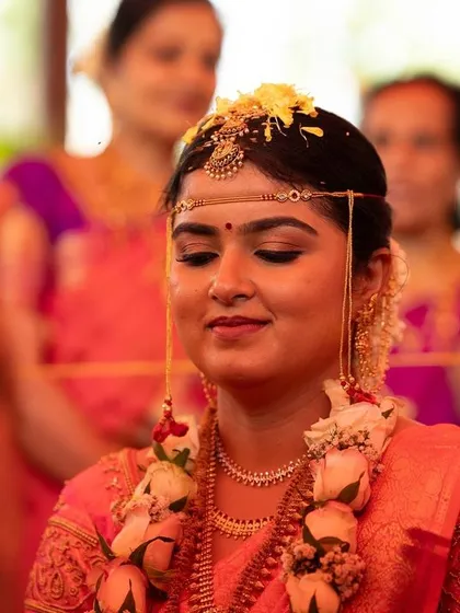 A candid moment during the wedding ceremony. The bride's makeup remains flawless even in close-up shots, highlighting the quality and longevity of the products I use.
