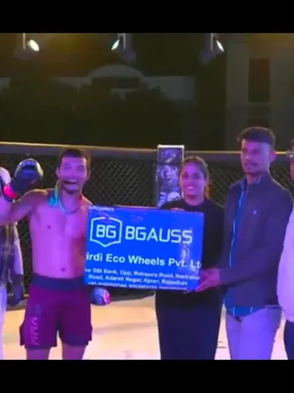 Our fighter receiving a cash prize for his victory at Elite Combat MMA, a reward for his outstanding performance.