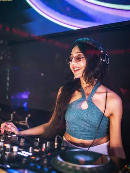 In my element, finding the perfect beat for the Saturday night crowd. A good club set is all about reading the room and keeping the energy high with a mix of new hits and throwback Bollywood anthems.