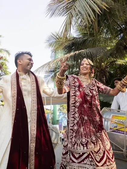 The energy of a dhol, the joy of a newly married couple, and the bright sun overhead. This candid shot captures the celebratory spirit as the bride and groom dance their way into their new life together.