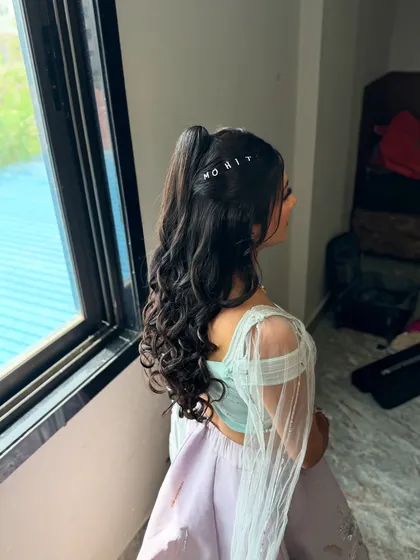 A close-up of the custom name pin hairstyle. It's these little details that make a look truly personal and special.