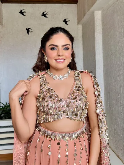 The full look, showing how the soft peach makeup tones work beautifully with the embellished outfit. This is a perfect example of coordinated cocktail glam.