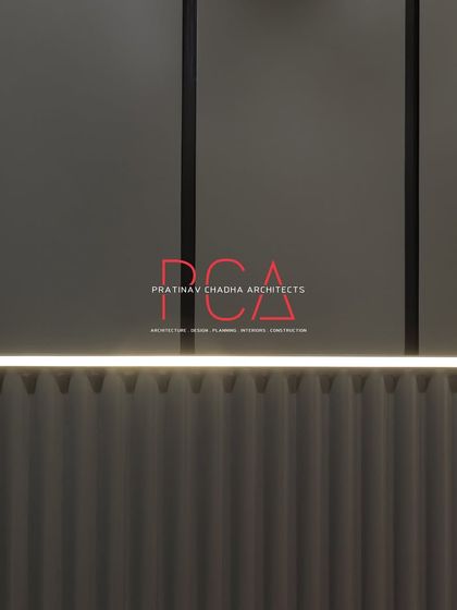 A detail shot of the wall paneling in a bedroom from 'The Cursive Abode'. This image highlights the clean lines, fluted textures, and integrated profile lighting that add a layer of sophistication.