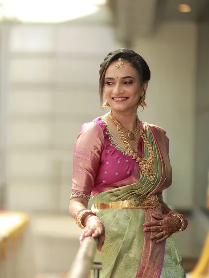 The perfect look for an engagement ceremony. I created a soft, romantic makeup look with a focus on radiant skin and a pretty pink lip to complement her lovely green and pink silk saree. Her happiness truly completes the look.
