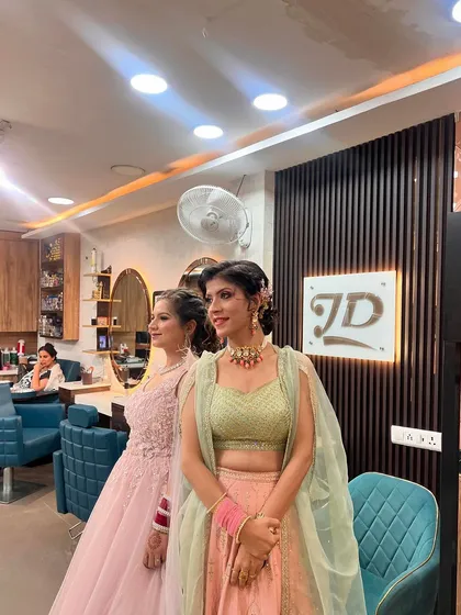 Another shot of our clients posing in the salon, showing off their different but equally glamorous looks.