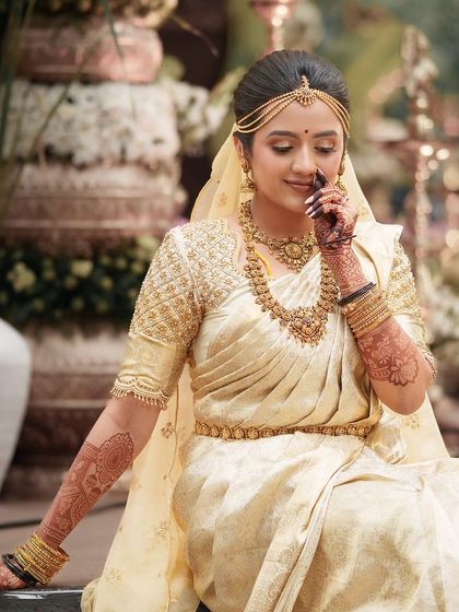 A serene and beautiful portrait of the bride, her intricate mehendi adding to her timeless look.