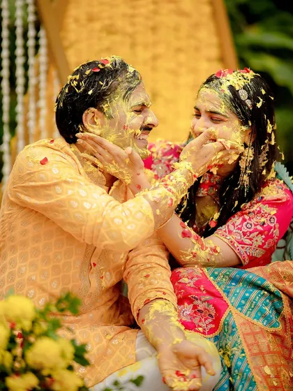The Haldi ceremony is all about playful masti, and this moment with Kunal and Arunima was pure gold. My documentary approach means I am always ready for these spontaneous bursts of fun and color.