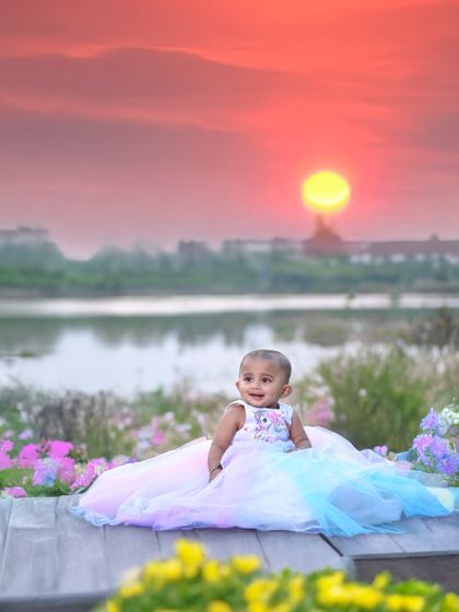 This is the edited version of the sunset portrait. I enhanced the colors of the sky and the landscape to create a more vibrant and artistic final image.