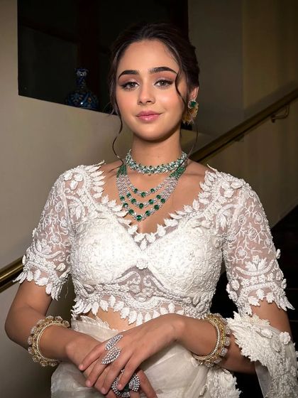 A full view of the Husn look, showcasing the intricate lace work on the saree and blouse.